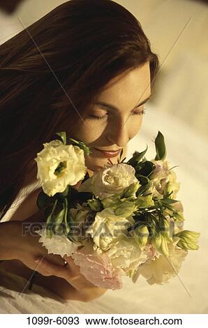 people, woman, smelling, sleeping, flowers, bouquet, brunette View Large Photo Image Stock Image - people, woman, smelling, sleeping, flowers, bouquet, brunette. Fotosearch