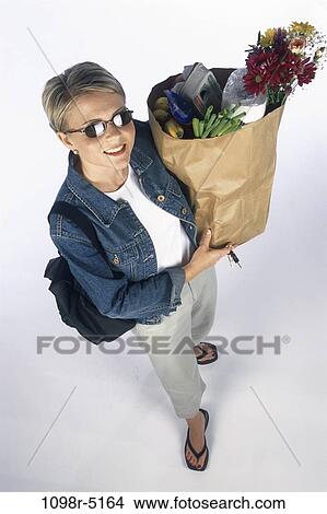 people, woman, sunglasses, carrying, shopping, blond, grocery View Large Photo Image Picture - people, woman, sunglasses, carrying, shopping, blond, grocery. Fotosearch