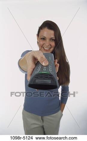 people, woman, watch, watching, television, brunette, remote View Large Photo Image Picture - people, woman, watch, watching, television, brunette, remote. Fotosearch