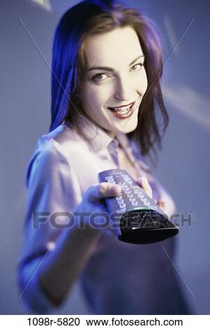 people, woman, watch, watching, television, brunette, remote View Large Photo Image Stock Image - people, woman, watch, watching, television, brunette, remote. Fotosearch