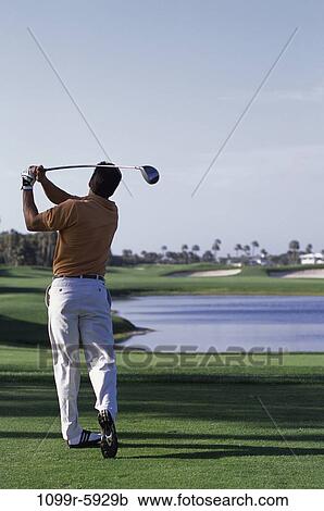 Stock Image - playing, golf, lake, outdoors, play, hitting. Fotosearch