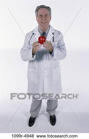 senior, healthy, apple, fruit, holding, doctor View Large Photo Image Stock Photo - senior, healthy, apple, fruit, holding, doctor. Fotosearch