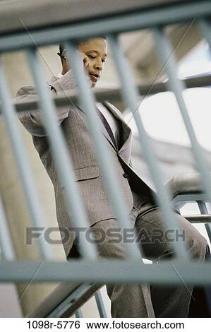 stairs, railing, walking, talking, phone, business View Large Photo Image Stock Photograph - stairs, railing, walking, talking, phone, business. Fotosearch