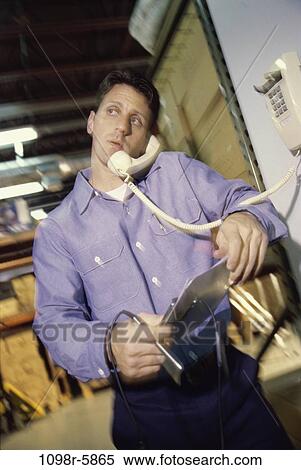 talking, phone, worker, warehouse, using, inventory View Large Photo Image Stock Photography - talking, phone, worker, warehouse, using, inventory. Fotosearch