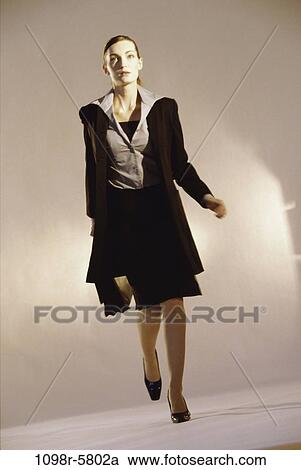 Stock Image - woman, business, indoors, Caucasian, businesswoman, young adult, Businesswomen individuals. Fotosearch