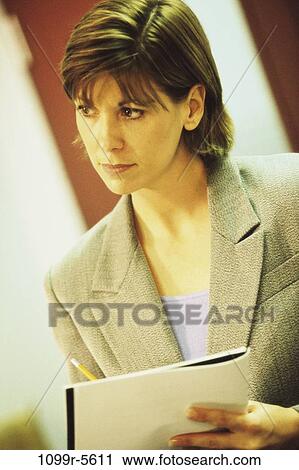 Stock Image - woman, business, indoors, Caucasian, businesswoman, young adult, Businesswomen individuals. Fotosearch