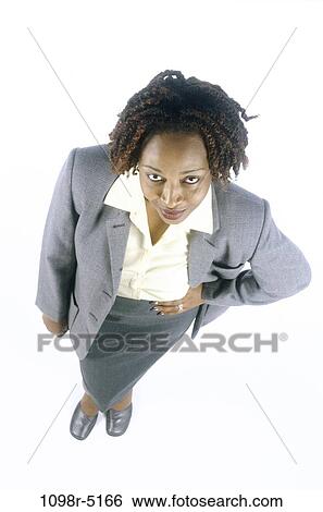 Stock Photograph - woman, business, indoors, African-American, businesswoman, young adult, cutout. Fotosearch