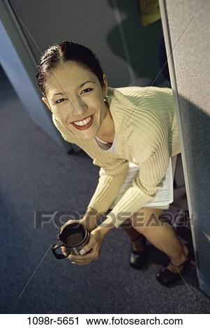 Stock Image - woman, coffee, Hispanic, business, cup, indoors, businesswoman. Fotosearch