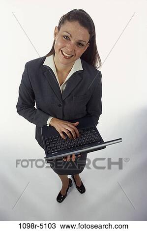woman, computer, laptop, typing, holding, business, Middle-aged View Large Photo Image Stock Image - woman, computer, laptop, typing, holding, business, Middle-aged. Fotosearch