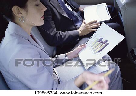 woman, graph, car, holding, chart, business, looking View Large Photo Image Picture - woman, graph, car, holding, chart, business, looking. Fotosearch