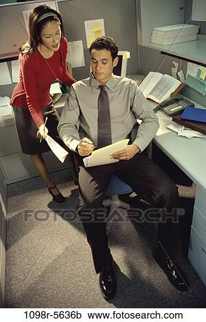 Stock Image - woman, paperwork, papers, business, Middle-aged, teamwork. Fotosearch