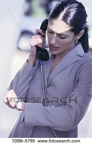 woman, talking, Hispanic, watch, business, outdoors, looking View Large Photo Image Stock Photography - woman, talking, Hispanic, watch, business, outdoors, looking. Fotosearch