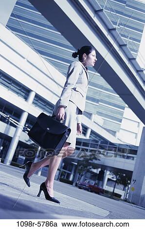 woman, walking, briefcase, Hispanic, appointment, business, outdoors View Large Photo Image Stock Image - woman, walking, briefcase, Hispanic, appointment, business, outdoors. Fotosearch