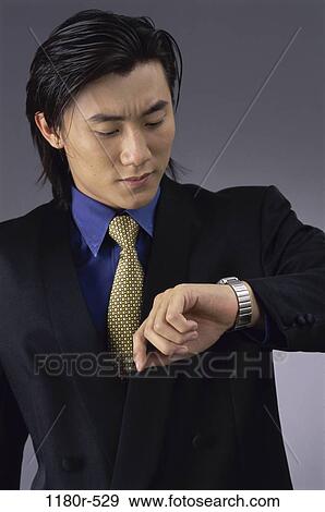 anticipating, watch, indoors, businessman, business, Asian View Large Photo Image Stock Photo - anticipating, watch, indoors, businessman, business, Asian. Fotosearch