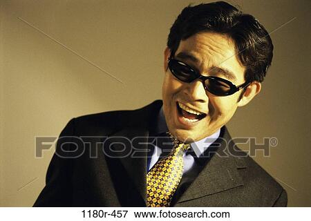 Stock Photo - blind, sunglasses, businessman, Middle-aged, business, Asian. Fotosearch