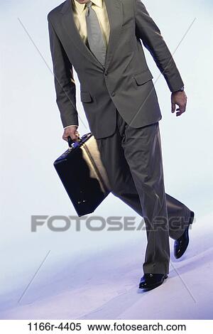 Stock Photography - briefcase, business, businessman, Businessmen individuals. Fotosearch