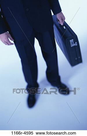 Stock Photography - briefcase, business, businessman, indoors, Businessmen individuals. Fotosearch