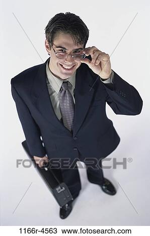 briefcase, eyeglasses, Hispanic, business, businessman, indoors View Large Photo Image Stock Image - briefcase, eyeglasses, Hispanic, business, businessman, indoors. Fotosearch