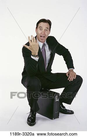 briefcase, sitting, business, Middle-aged, frustrated, angry View Large Photo Image Stock Image - briefcase, sitting, business, Middle-aged, frustrated, angry. Fotosearch