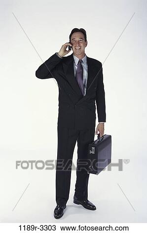 briefcase, talking, phone, business, Middle-aged, cell phone, businessman View Large Photo Image Stock Image - briefcase, talking, phone, business, Middle-aged, cell phone, businessman. Fotosearch