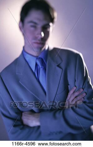 Stock Photograph - business, businessman, indoors, young adult, Businessmen individuals. Fotosearch