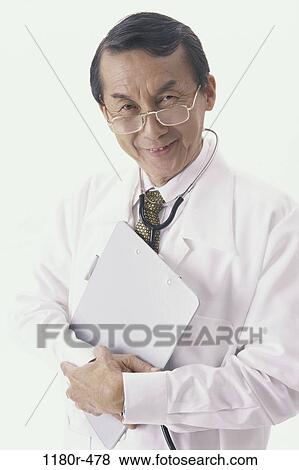 Stock Photo - chart, eyeglasses, stethoscope, doctor, senior, Asian. Fotosearch