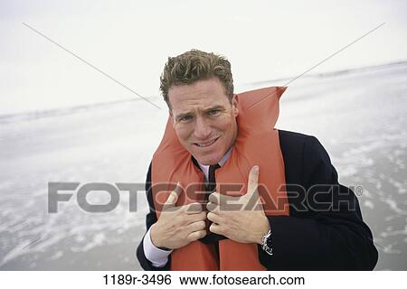 Stock Photograph - danger, beach, business, risk, Middle-aged, worry. Fotosearch