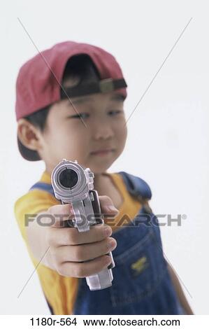 danger, people, hat, gun, Asian, holding, boy View Large Photo Image Picture - danger, people, hat, gun, Asian, holding, boy. Fotosearch