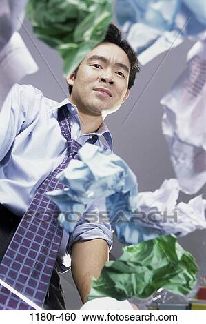 Stock Image - desk, Asian, stress, business, chaotic, frustrated. Fotosearch