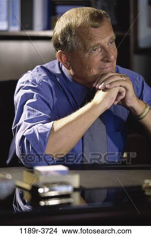 desk, business, Middle-aged, contemplating, businessman View Large Photo Image Picture - desk, business, Middle-aged, contemplating, businessman. Fotosearch