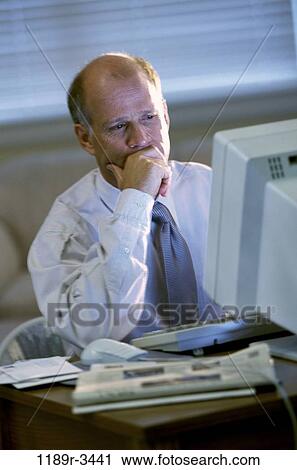 desk, computer, concentrating, business, Middle-aged, contemplation View Large Photo Image Stock Image - desk, computer, concentrating, business, Middle-aged, contemplation. Fotosearch