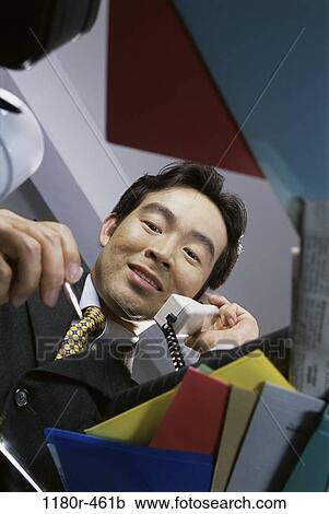 desk, telephone, talking, Asian, phone, business View Large Photo Image Stock Image - desk, telephone, talking, Asian, phone, business. Fotosearch