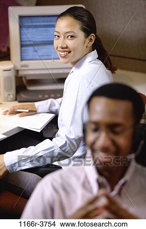 desk, telephone, talking, computer, phone, business, casual View Large Photo Image Picture - desk, telephone, talking, computer, phone, business, casual. Fotosearch