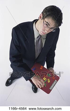 eyeglasses, business, businessman, indoors, Caucasian, young adult View Large Photo Image Picture - eyeglasses, business, businessman, indoors, Caucasian, young adult. Fotosearch