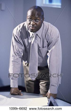 eyeglasses, business, businessman, indoors, young adult View Large Photo Image Stock Image - eyeglasses, business, businessman, indoors, young adult. Fotosearch