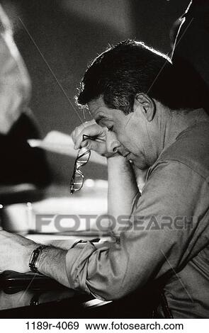 eyeglasses, exhaustion, stress, defeat, Middle-aged, tired View Large Photo Image Stock Photo - eyeglasses, exhaustion, stress, defeat, Middle-aged, tired. Fotosearch