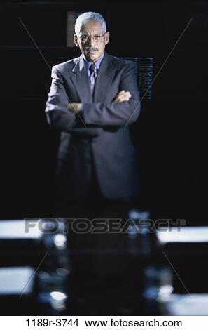 Picture - eyeglasses, Hispanic, business, Middle-aged, mustache, serious. Fotosearch