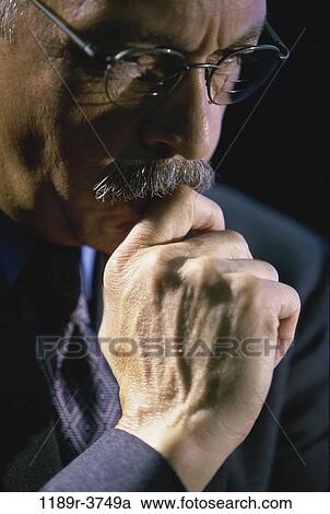 Stock Image - eyeglasses, Hispanic, business, Middle-aged, mustache, serious. Fotosearch
