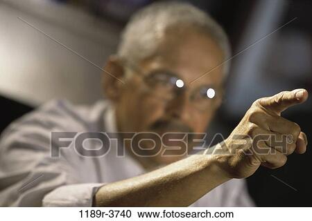 eyeglasses, Hispanic, pointing, business, point, Middle-aged View Large Photo Image Stock Image - eyeglasses, Hispanic, pointing, business, point, Middle-aged. Fotosearch