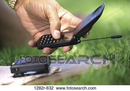 hand, industry, phone, communications, outdoors, using, cell phone View Large Photo Image Stock Image - hand, industry, phone, communications, outdoors, using, cell phone. Fotosearch