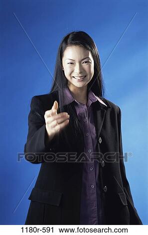 Stock Image - hand, woman, Asian, business, gesture, indoors, businesswoman. Fotosearch