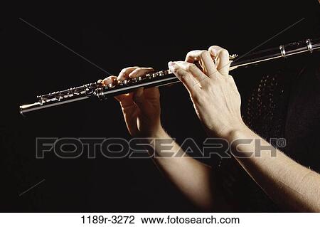 Stock Image - hands, playing, arts, entertainment, play, flute, musical. Fotosearch