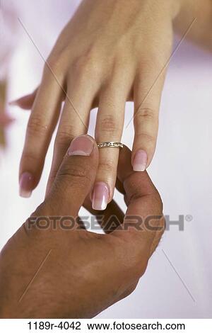 Stock Image - hands, ring, wedding, still life, marriage, married. Fotosearch