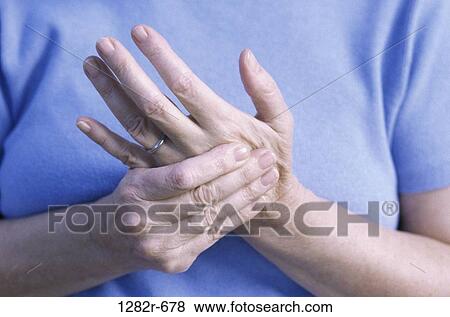 Stock Photo - hands, woman, pain, illness, massage, Medical adult patients. Fotosearch