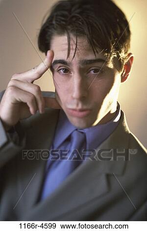 Stock Photo - headache, stress, business, businessman, indoors, Caucasian. Fotosearch