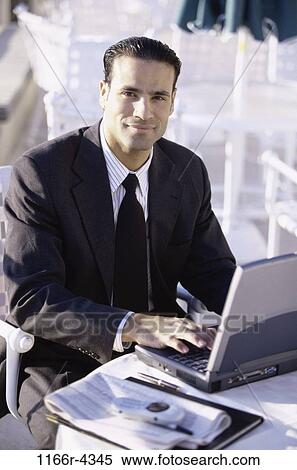 Hispanic, computer, laptop, business, outdoors, Middle-aged View Large Photo Image Stock Photography - Hispanic, computer, laptop, business, outdoors, Middle-aged. Fotosearch