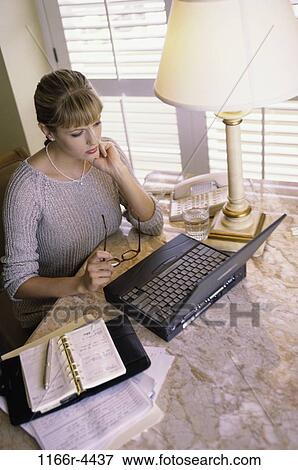 hotel, desk, woman, eyeglasses, computer, appointment book, laptop View Large Photo Image Stock Photo - hotel, desk, woman, eyeglasses, computer, appointment book, laptop. Fotosearch