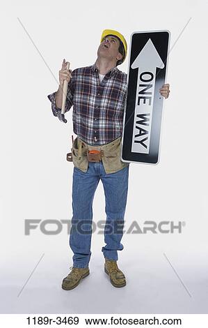 industry, construction, holding, worker, Middle-aged, sign View Large Photo Image Stock Photo - industry, construction, holding, worker, Middle-aged, sign. Fotosearch
