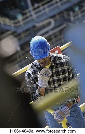 Stock Image - industry, construction, talking, worker, industrial, radio, occupation. Fotosearch
