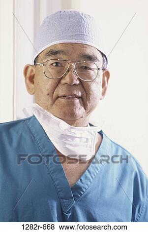 Stock Photo - medical personnel, senior, medicine, doctor, scrubs, Asian. Fotosearch